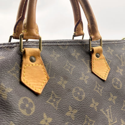 Louis Vuitton Speedy 30 Toile Monogram - détail des anses et attaches en cuir naturel