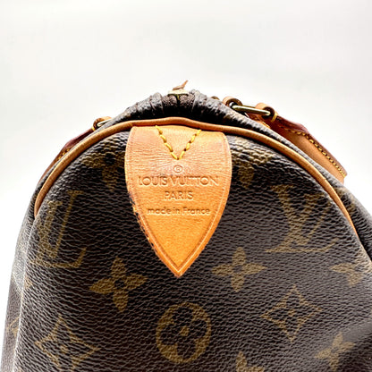 Louis Vuitton Speedy 30 Toile Monogram - détail de la patte latérale en cuir naturel