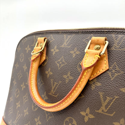 Louis Vuitton Alma Toile Monogram - détail des anses en cuir naturel