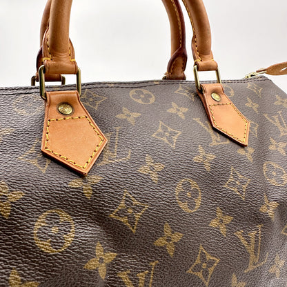 Louis Vuitton Speedy 30 Toile Monogram - détail des anses et attaches en cuir naturel