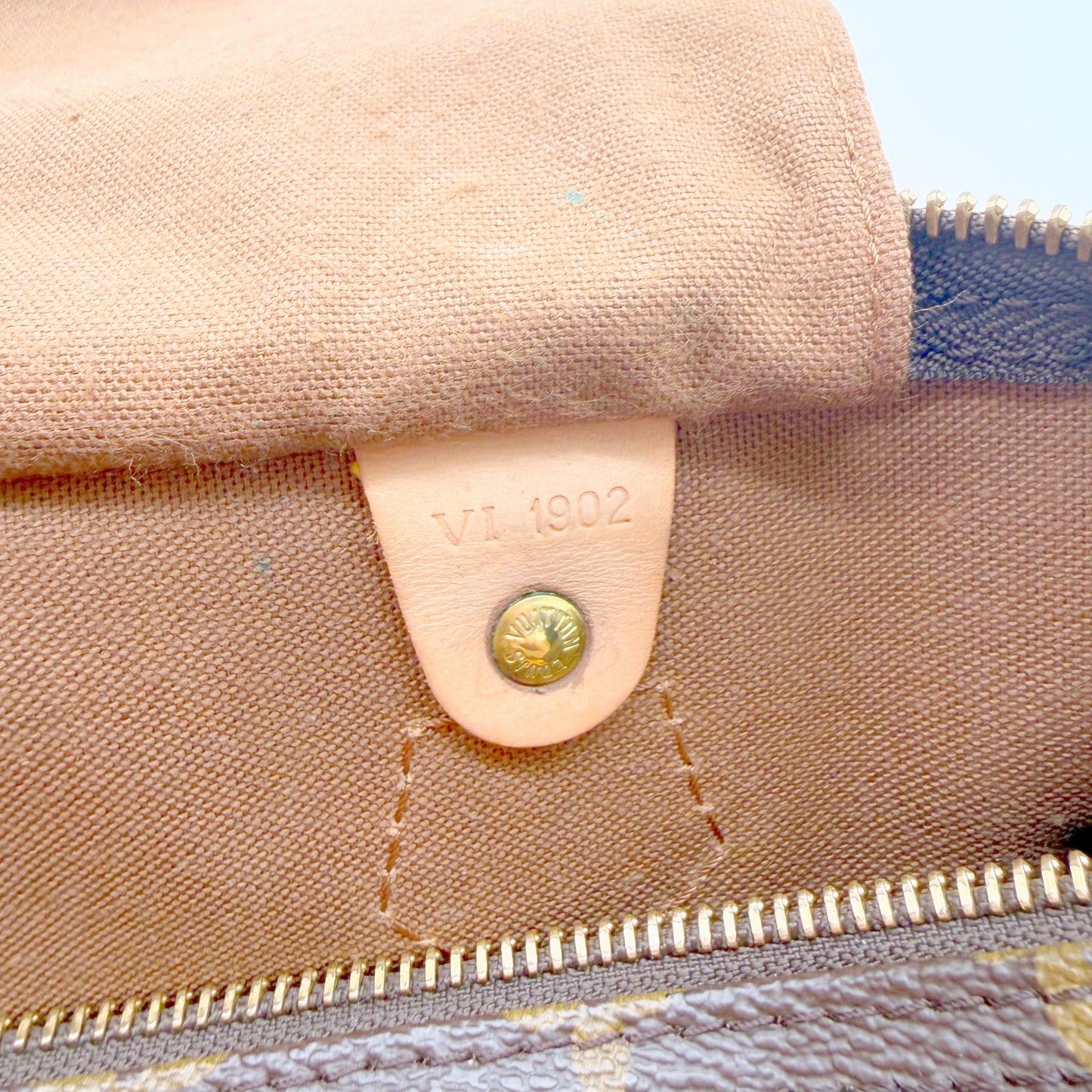 Louis Vuitton Speedy 30 toile Monogram - languette intérieure avec code date