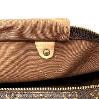 Louis Vuitton Speedy 30 Toile Monogram - détail de la doublure intérieure et de sa patte de cuir