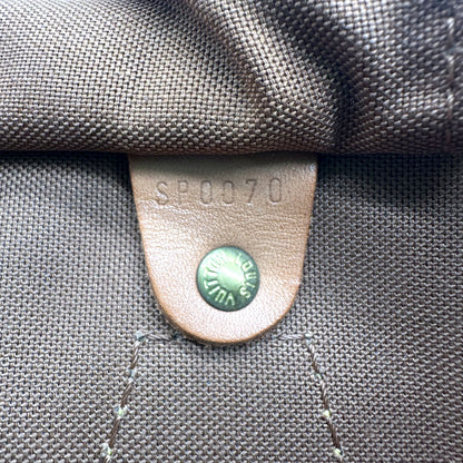 Louis Vuitton Speedy 35 Toile Monogram - détail de la doublure intérieure et de sa patte de cuir