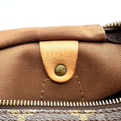 Louis Vuitton Speedy 30 Toile Monogram - détail de la doublure intérieure et de sa patte de cuir