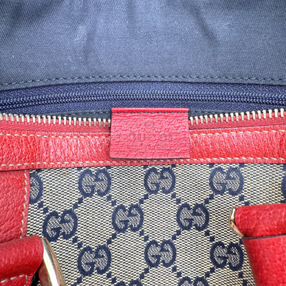 Gucci Boston Abbey Toile GG et Cuir Rouge - détail de la fermeture et de la patte de cuir