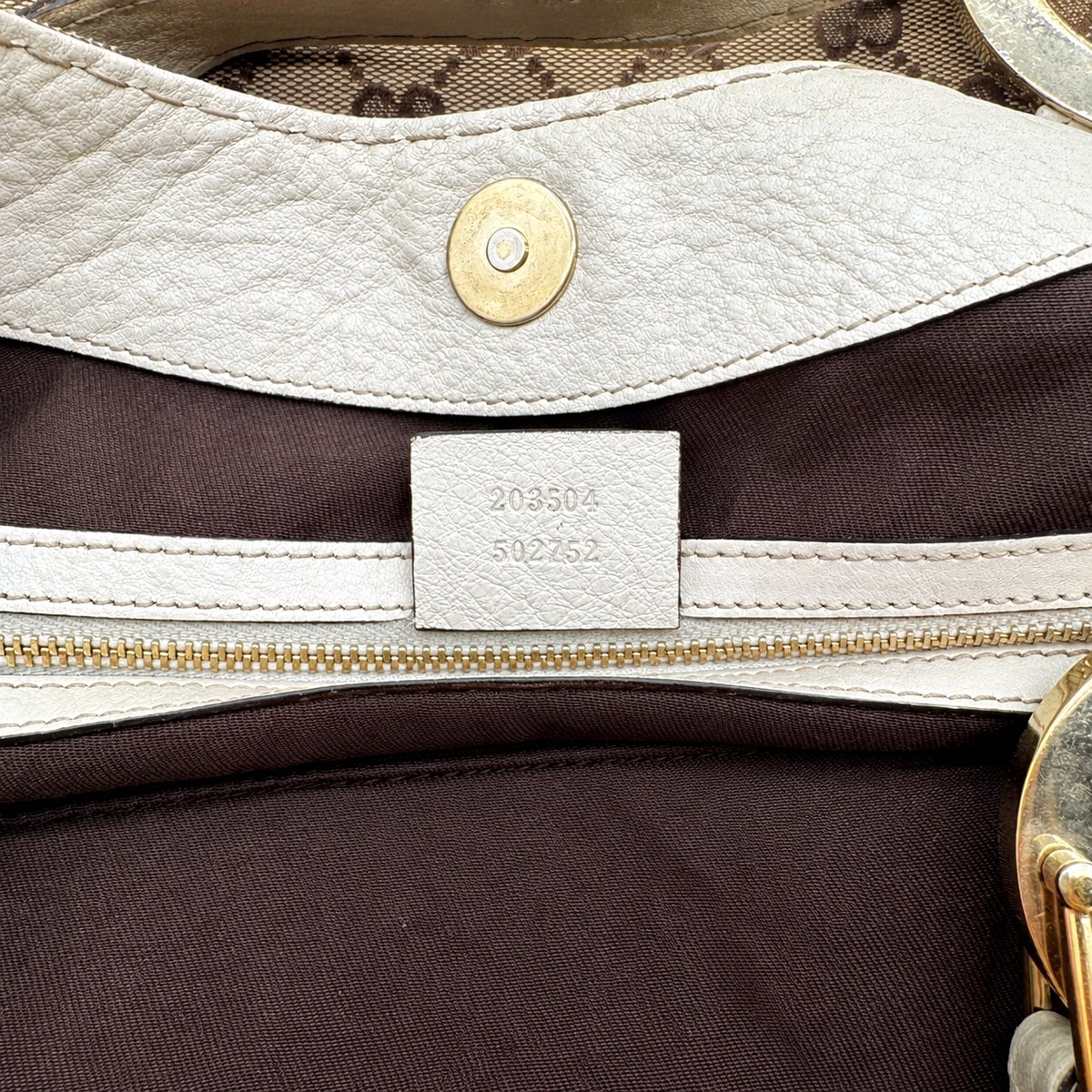 Gucci Tote Toile GG Beige et Cuir Crème - détail de l'étiquette intérieure et de la référence
