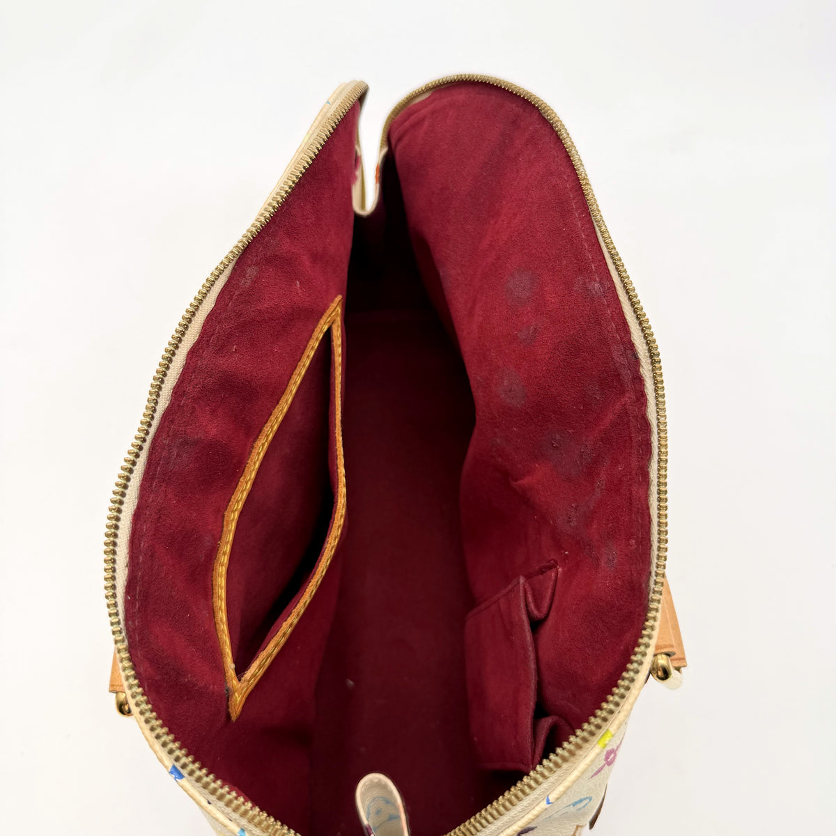 Louis Vuitton Alma Toile Monogram Multicolore Blanc - intérieur ouvert, doublure framboise et poche