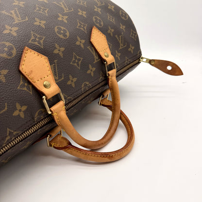 Louis Vuitton Speedy 35 Toile Monogram - détail anses attaches laiton et tirette