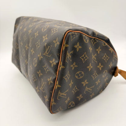 Louis Vuitton Speedy 30 Toile Monogram - base et coins, passepoil cuir