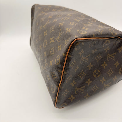 Louis Vuitton Speedy 35 Toile Monogram - base et coins, passepoil cuir
